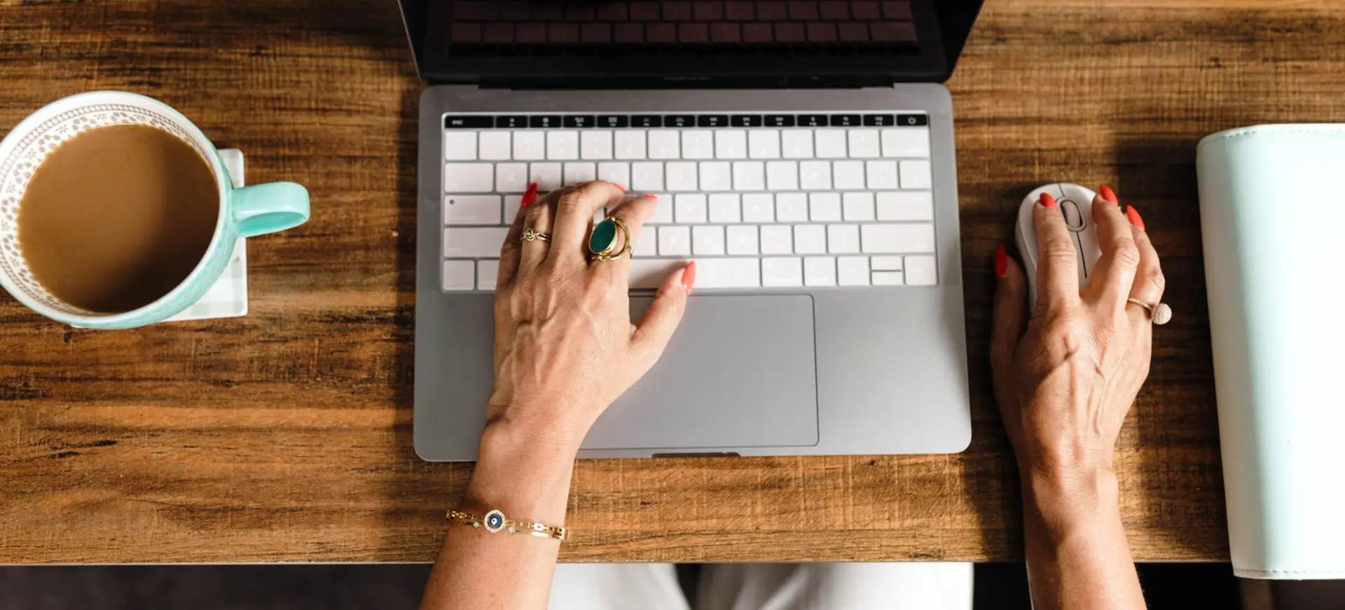 A person typing on a laptop computer.